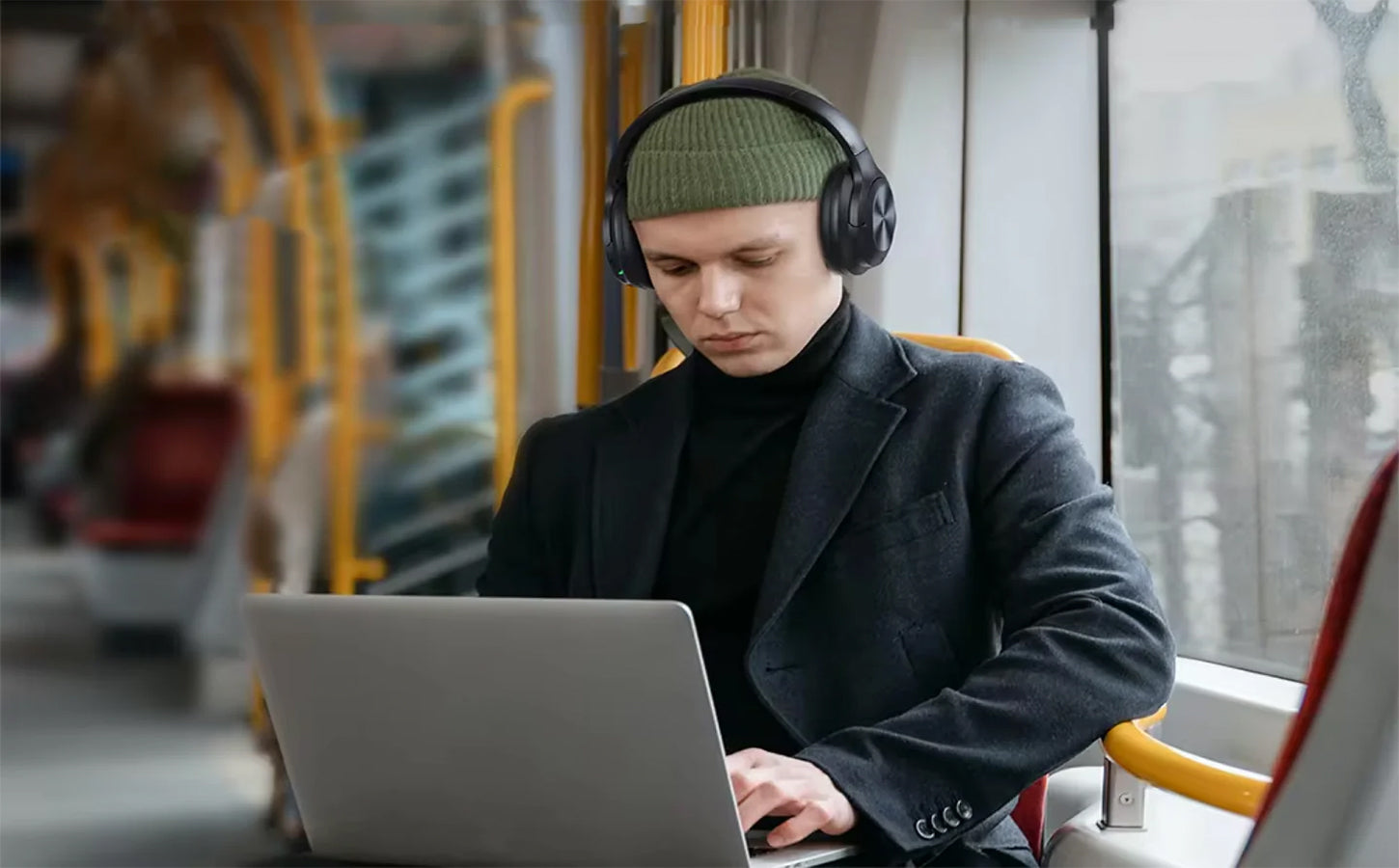 User wearing EchoNova Headphones while working remotely outdoors