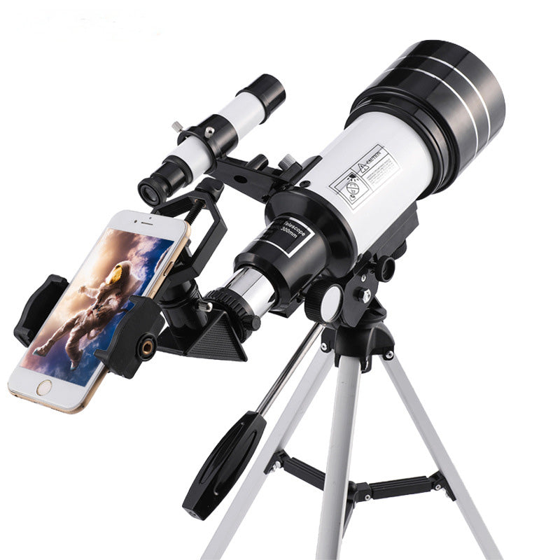 Child adjusting StarVista Optics telescope for stargazing
